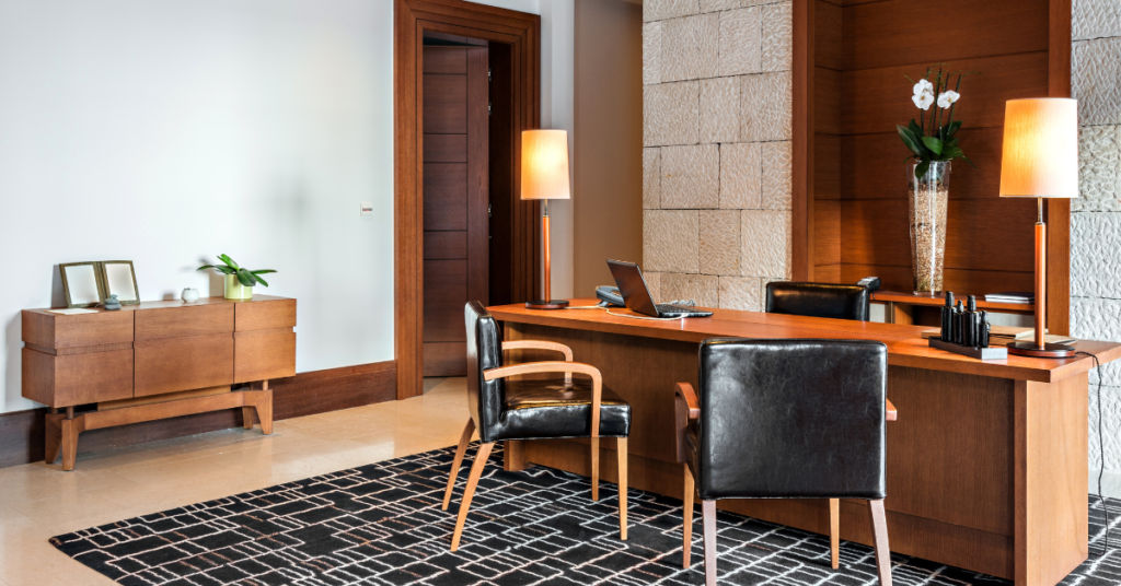 Typically, your actual work office has a chair or two in front of your desk so you can attend to your clients or colleagues. That said, your ideal home office setup must be able to do the same.